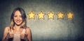 ÃÂ¡heerful beautiful woman smiling showing thumb up like gesture choosing five stars rating